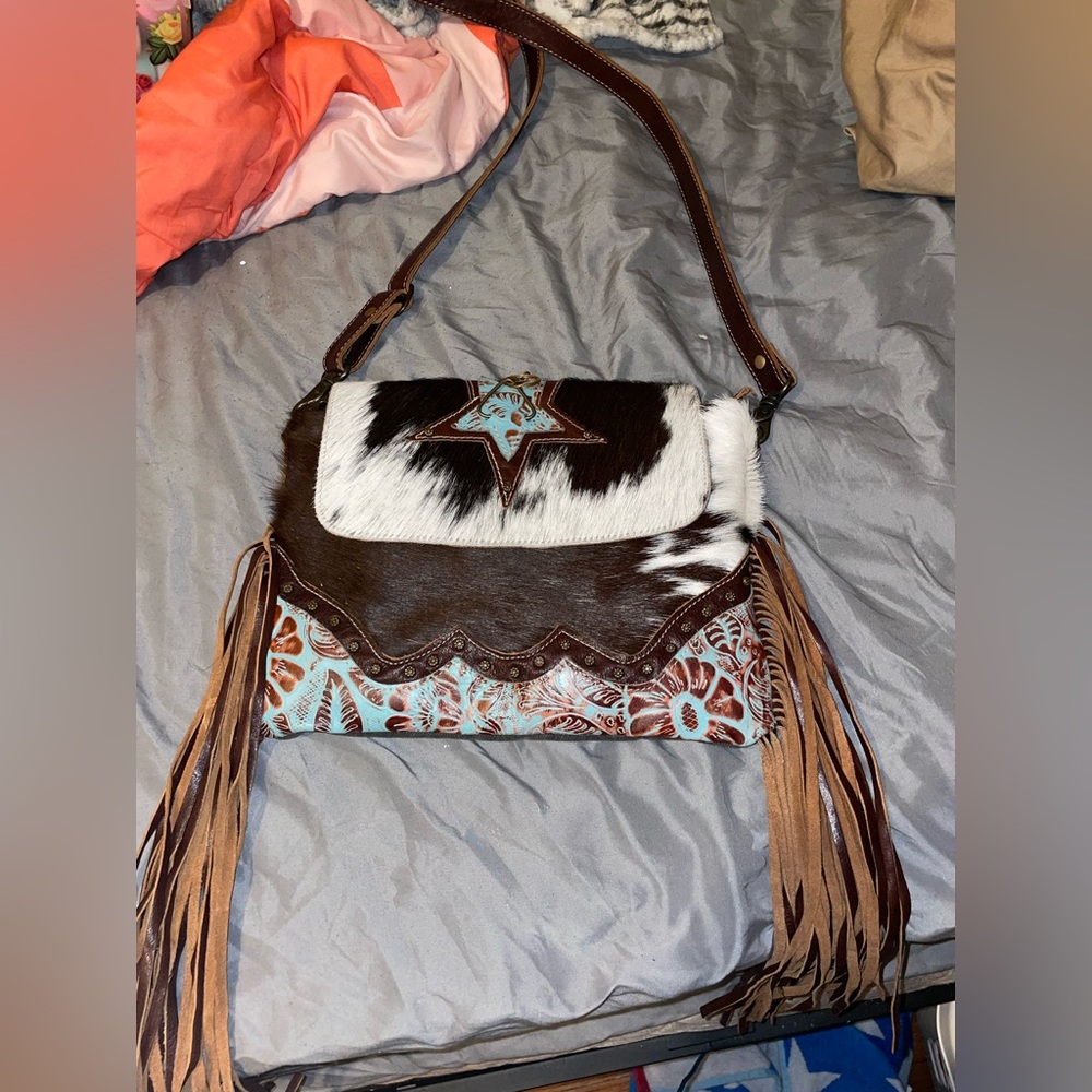 Cow print fringe purse